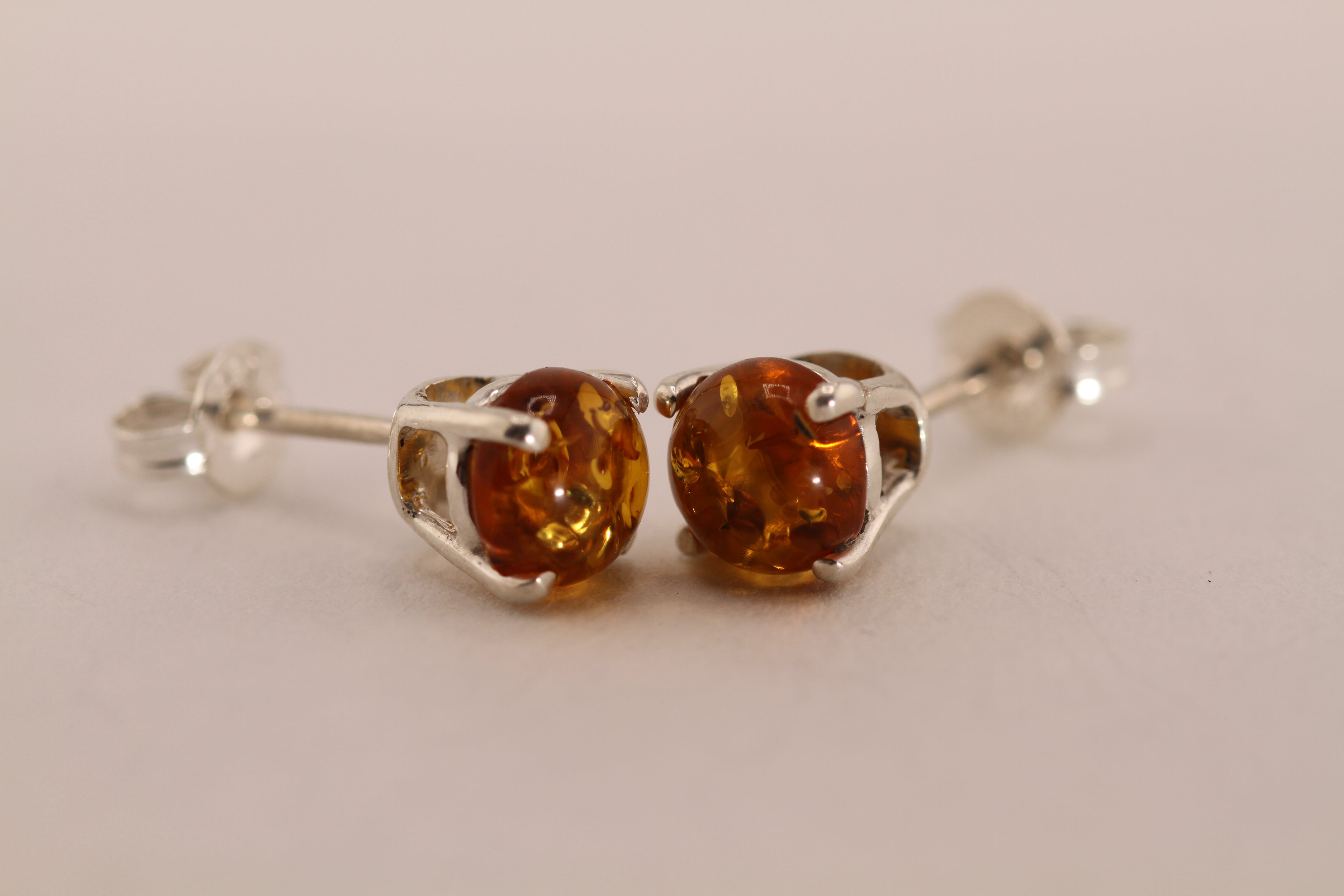 Sterling Silver stud earrings with natural Amber